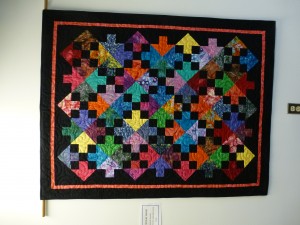  quilt donated by BMQG to BACI and hanging in its Still Creek Large Ed Centre